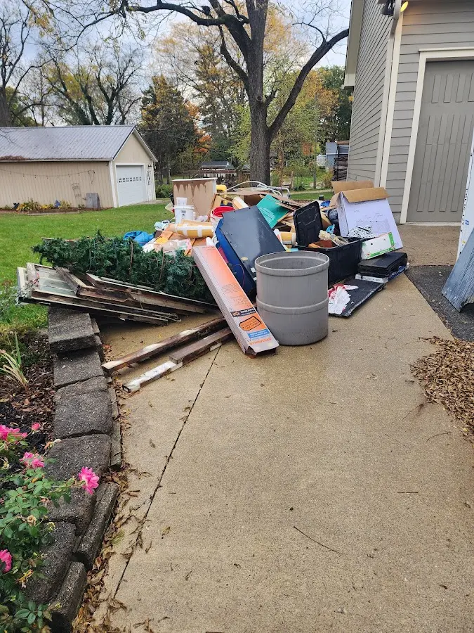 Dumpster being loaded with debris for Demolition Dumpster Rental in Robeson